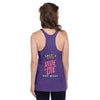 back view of next level women's racerback tank in purple rush featuring a classic halloween witch the 2023 zombie bike ride logo and the words ride or die key west